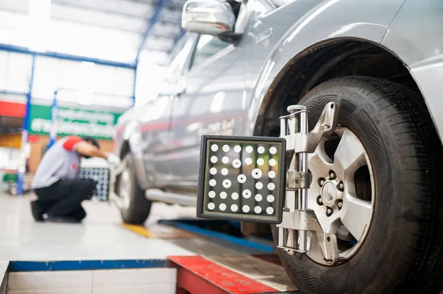Wheel alignment equipment mounted to a vehicle wheel